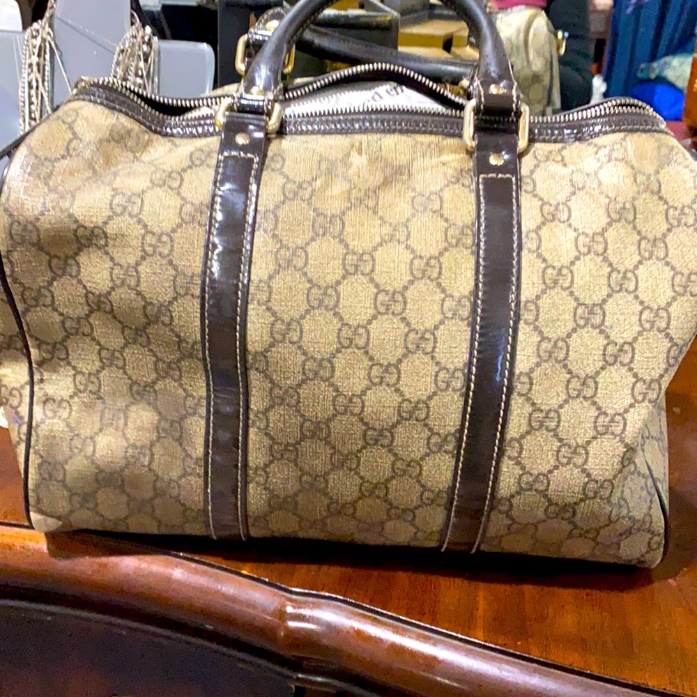 Authentic  Wore at bottom of purse ,looking at pictures